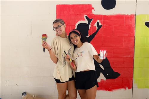 Photo of college volunteers painting